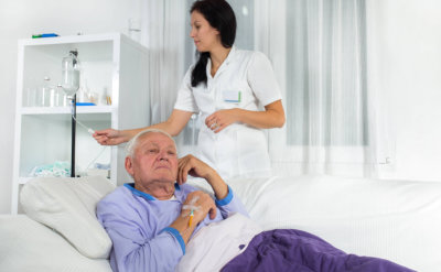older men receives infusion in hospital
